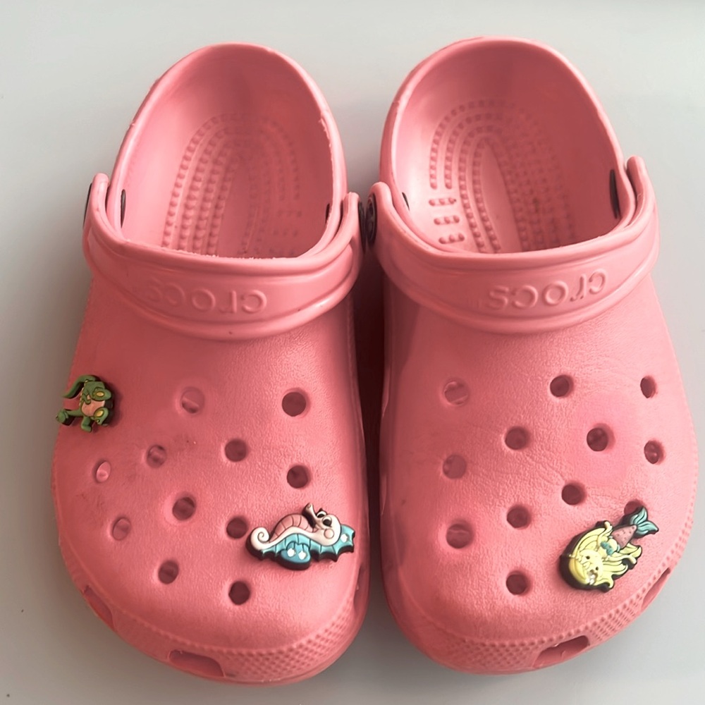 Girls Pink Crocs Girls Size 1, some discoloration where Jibbets were